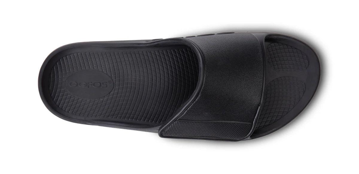 OOFOS Sport Flex slide in matte black, top-down view of the contoured footbed