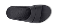 OOFOS OOahh Slide 1100 in black, top view of the contoured footbed