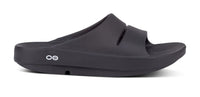 OOFOS OOahh Slide 1100 in black, three-quarter view
